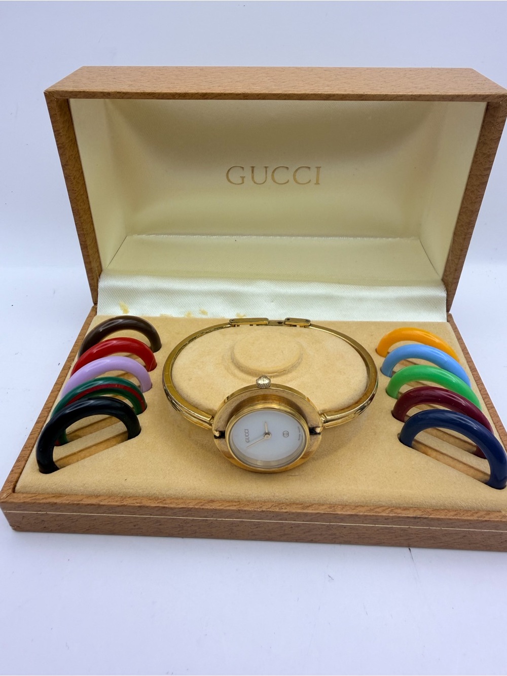 Gucci Gold Women's Interchangeable Bezel Bangle Watch with Colorful Bezels